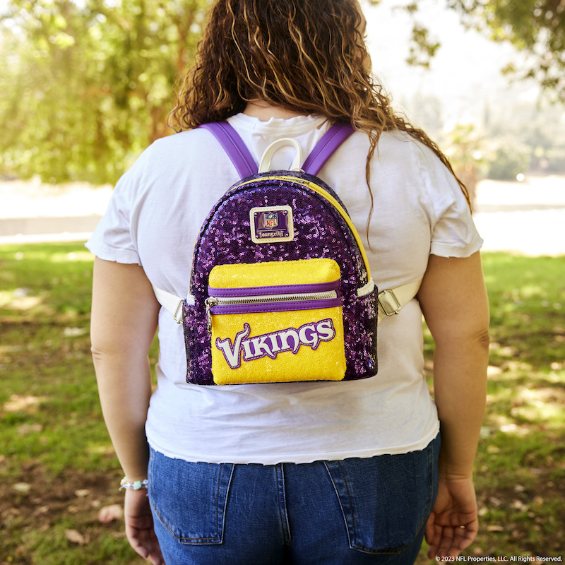 Image of woman facing away from camera wearing the NFL Minnesota Vikings Sequin Mini Backpack 